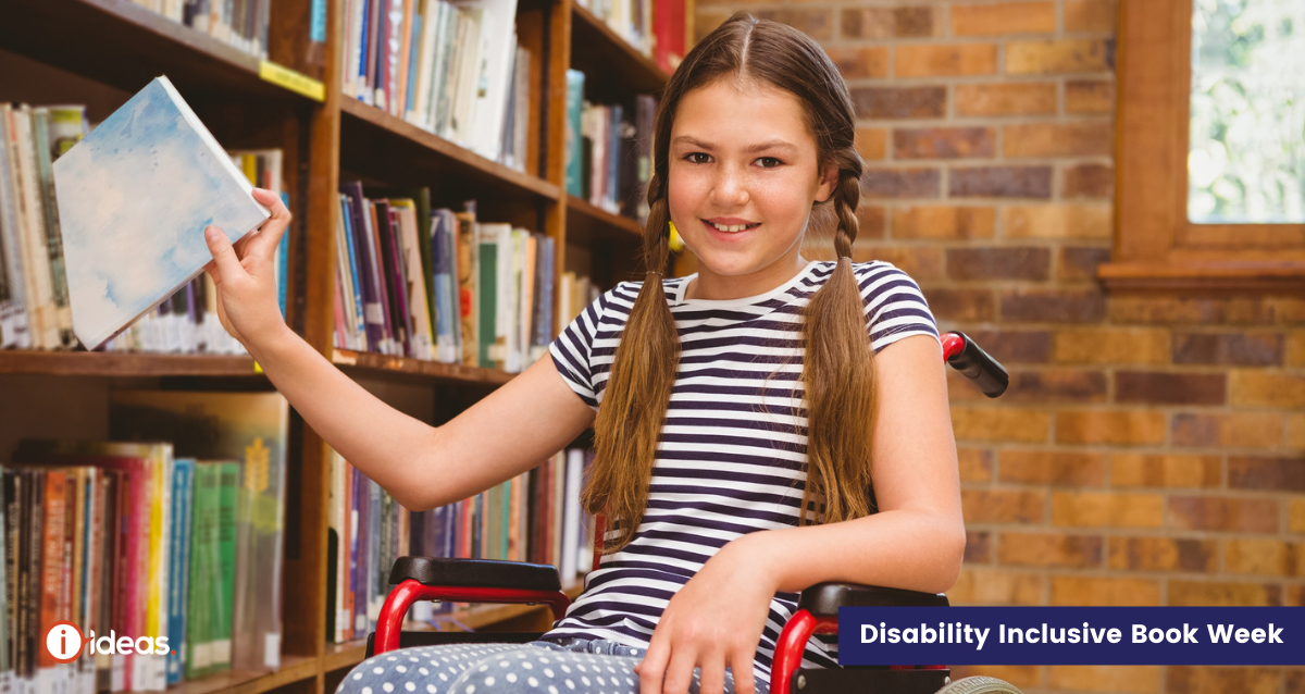 Young girl getting a book from a library shelf - she is using a wheelchair 