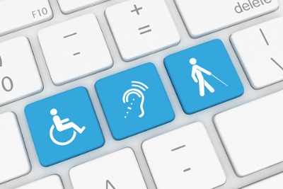 3 blue keys on a keyboard. Each key has a symbol for accessibility. From left to right: Wheelchair access. Hearing loop and a person with low vision using a cane.  