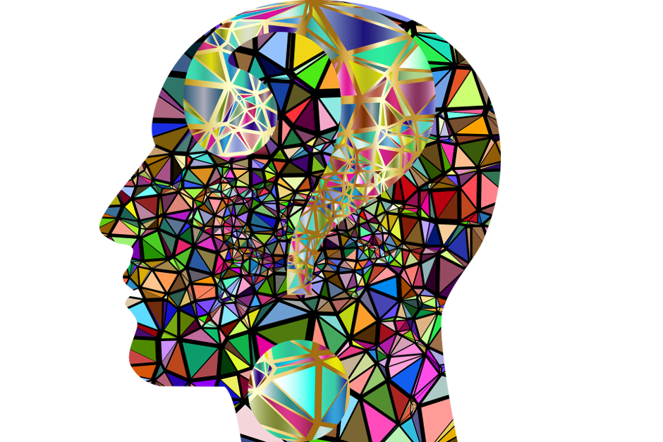 Sillohuette of human head made of multicoloured rainbow shards