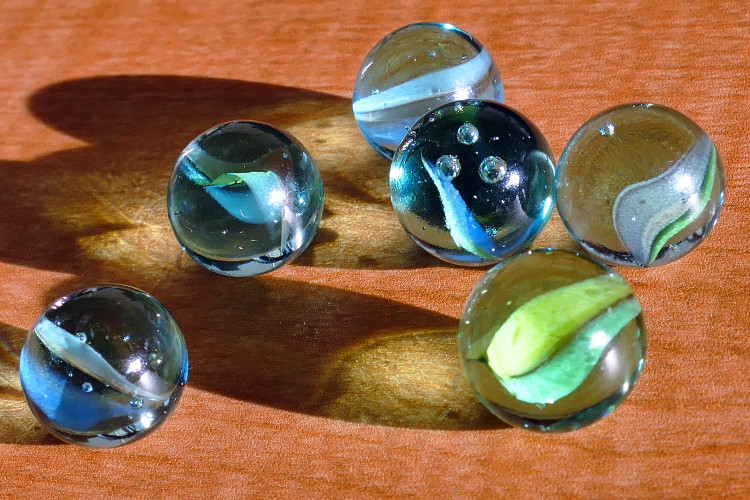 Glass marbles. Timeless play.