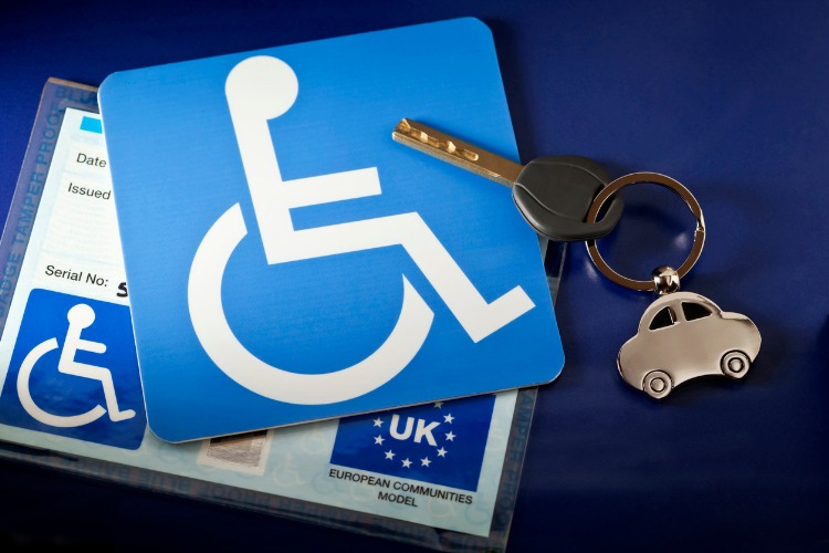 Key and key ring with a disability parking permit
