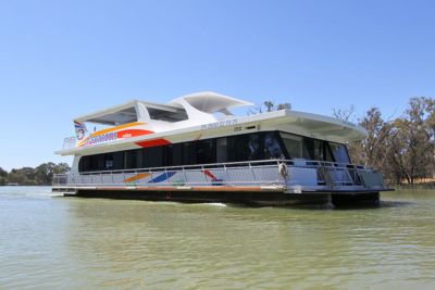 Image of a Houseboat on the water viewed from side on.