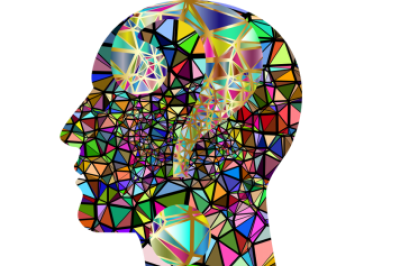 Sillohuette of human head made of multicoloured rainbow shards
