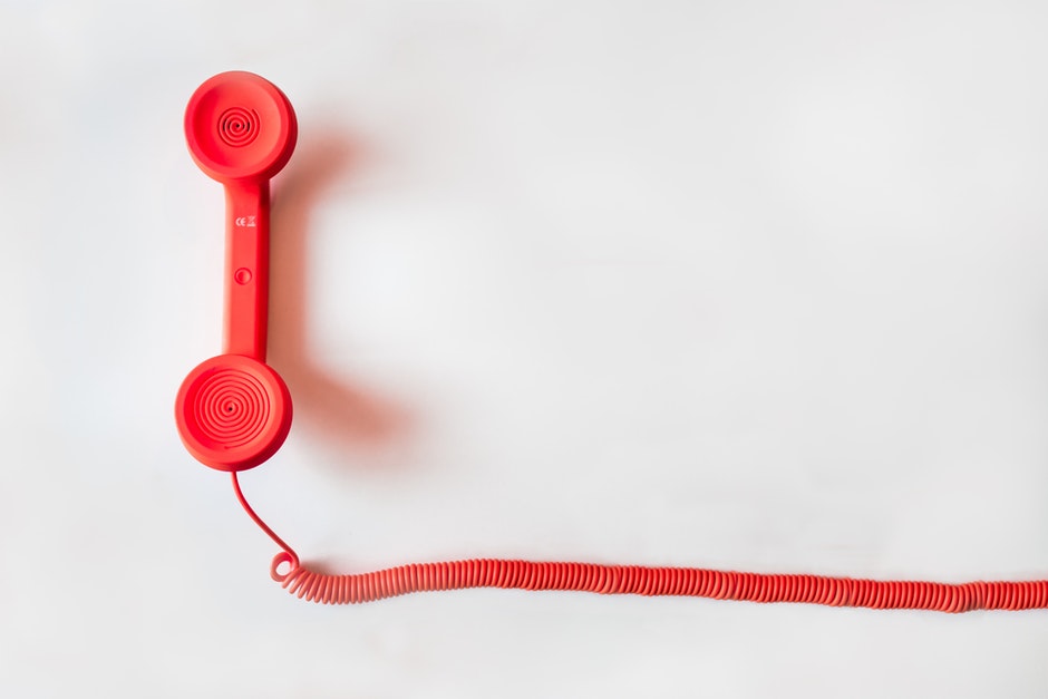 red corded handset for old style rotary phone. 