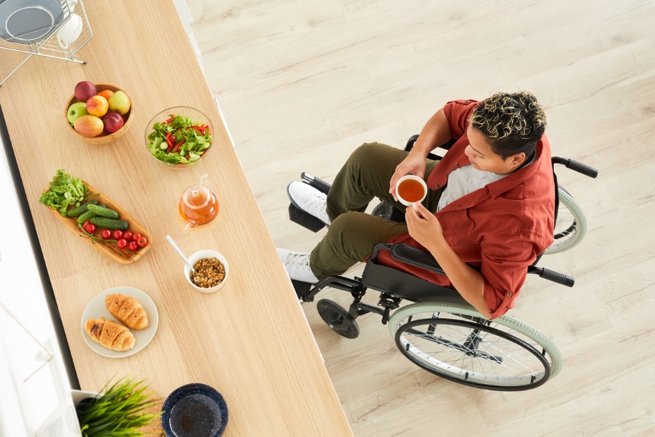 healthy food and woman in wheelchair drinking tea